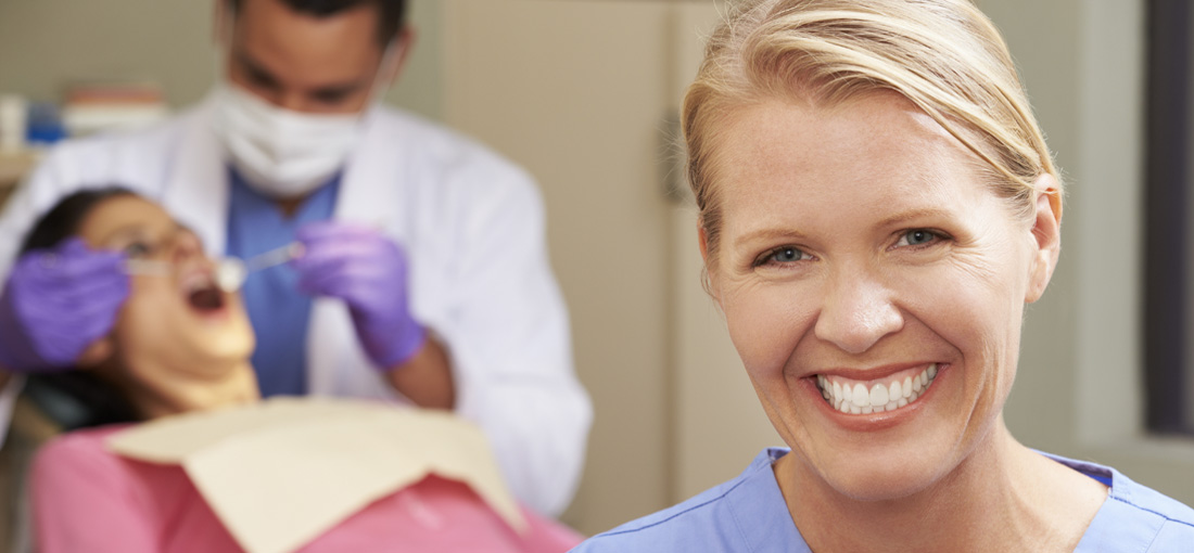 dental assistant smiling during appointment