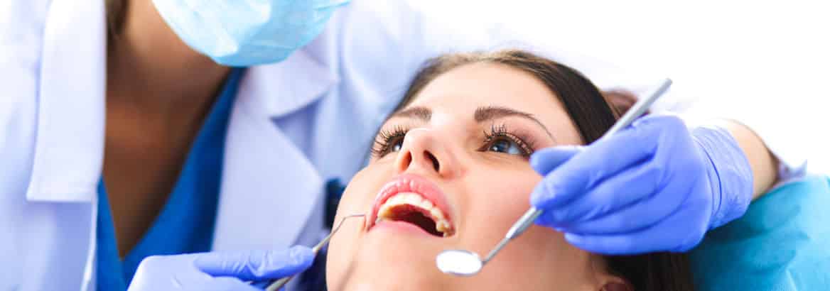 woman receiving dental cleaning
