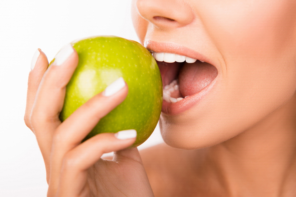 Woman eating apple